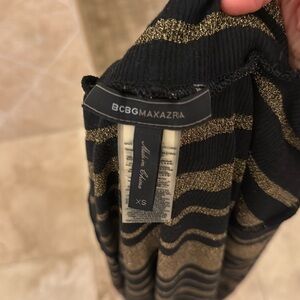 Gold and black striped sheer top from BCBG xs